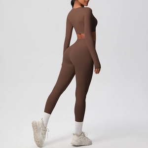Detail of coffee brown yoga set featuring high-waist leggings and long-sleeve crop top