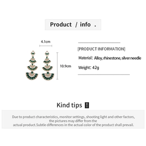 Detailed view showing the 10.9cm length and 4.1cm width of emerald rhinestone fan earrings