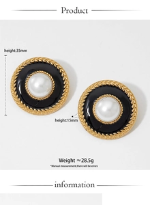 Detail view of French vintage round earrings with color-contrast enamel and metal texture