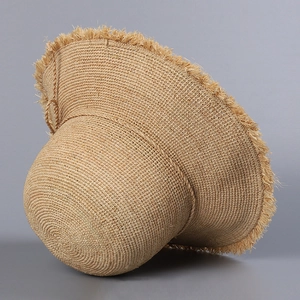 Handcrafted raffia sun hat with frayed tassel edges and wide brim for summer beach style