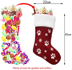 Detail showing red Christmas stocking dimensions 45x22cm with paw print embroidery