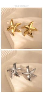 Macro detail of starfish earrings in gold and silver finish with matte texture