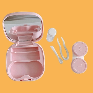 Pink portable contact lens case detail showing mirror, tweezers, bottle and L/R lens holder