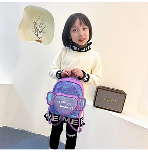 Girl's purple sequin backpack featuring a heart pocket and decorative wings detail