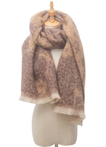 Detailed close-up of brown and cream floral jacquard scarf with decorative fringe edge
