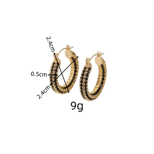 Detail shot showing 2.4cm gold hoop earrings with black micro-pave zircon crystals