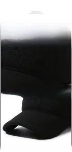 Detailed view of winter baseball cap featuring wool texture and metal MR side buckle