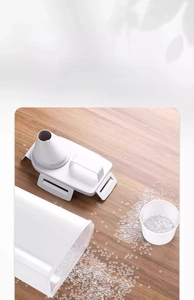 Detail of durable white plastic cereal container with handle and measuring cup