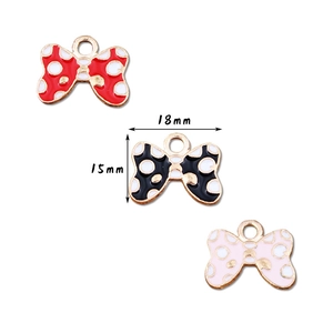 Polka dot bow jewelry pendants in red, black, and pink colors for DIY crafting