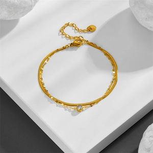 Double-layered gold titanium steel bracelet with white zircon on geometric stand