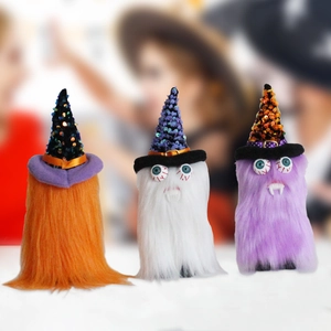 Three plush Halloween gnomes with sequined wizard hats and vampire teeth decorations