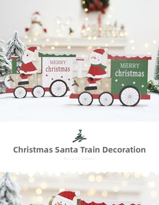 Detailed view of festive wooden Christmas train with Santa Claus and Snowman on faux snow