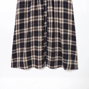 Fashionable dark blue and brown checkered midi dress with pleated detail and fabric texture