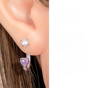 Detail of heart-shaped opal ear jacket with cubic zirconia accents on stainless steel