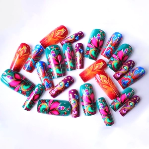 Colorful mandala floral press-on nails set with vibrant blue and pink patterns