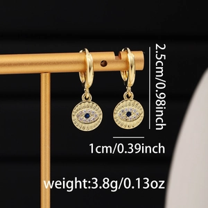 Detailed view of gold evil eye drop earrings with dimensions 2.5cm by 1cm and 3.8g weight