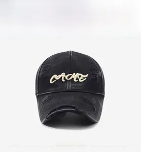 Detailed macro view of vintage distressed black cotton cap with 3D CACHE embroidery
