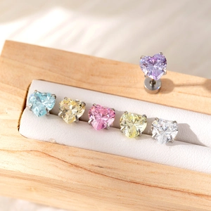 Titanium steel heart-shaped zircon earrings in six colors displayed on a wooden jewelry box