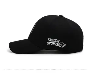 Side view detail of black baseball cap featuring white Fashion Sports wing embroidery