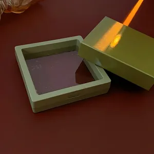 Green floating jewelry display box with PE film and matching paper packaging box