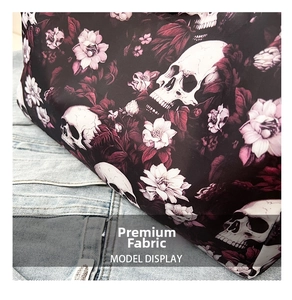 Close-up of gothic skull and floral print fabric on a stylish large capacity tote bag
