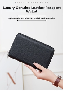 Detailed view of women's black pebble leather passport wallet with silver metal zipper