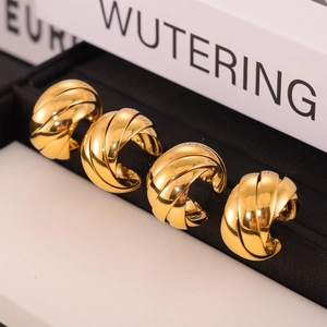 Classic gold twisted rope hoop earrings in polished titanium steel for women