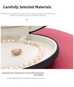 Detail of premium PU leather oval jewelry box with soft microfiber lining and pearl inlay