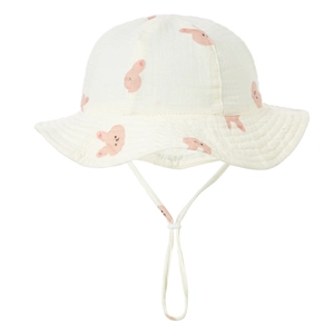 Detail of baby cotton gauze sun hat with animal prints and adjustable windproof strap