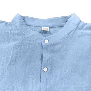 Detail shot of men's blue linen-cotton shirt collar with size XXL and 100% cotton label