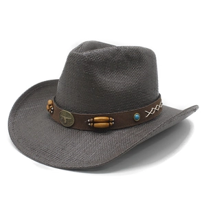 Cappello da cowboy in paglia marrone con cinturino in pelle, teschio di toro e turchese