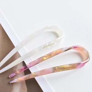 Minimalist marble pattern acetate U-shaped hair pins in cream and amber pink colors