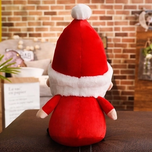 Close-up of the back of a plush Santa Claus toy in soft red fabric with white faux fur trim