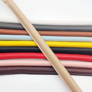 Detail of thickened leather handbag straps with stitching in multiple color options