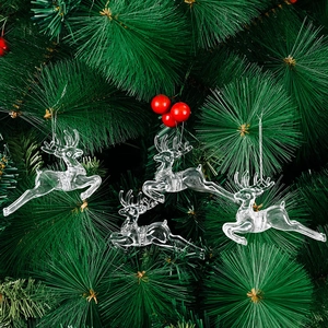 Transparent acrylic Christmas reindeer ornaments hanging on a green Christmas tree