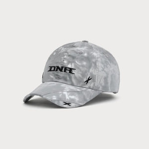Macro shot of grey tie-dye baseball cap featuring black DNR and X symbol embroidery