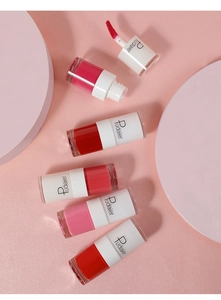 Detailed view of matte liquid lipstick set in transparent bottles with white caps