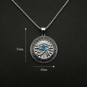 Vintage silver Eye of Horus necklace with blue eye pendant on a metal box chain