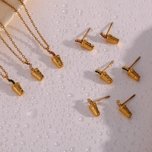 Detail of 18K gold necklaces and earrings with colorful zircon cola cup pendants
