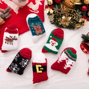 Thick coral fleece Christmas socks featuring reindeer and Santa Claus holiday patterns