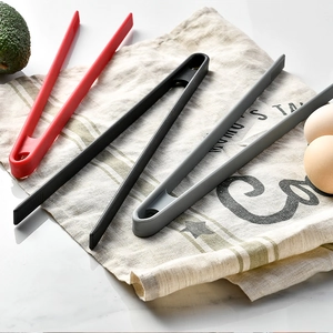 Three-piece heat-resistant silicone food tongs in red, black, and grey for cooking and BBQ