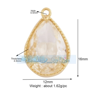 Macro detail of teardrop clear zircon pendant with gold plated frame and dimensions