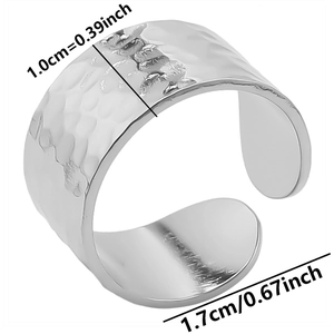 Detail view of 1.0cm wide adjustable open ring with hammered texture in silver finish