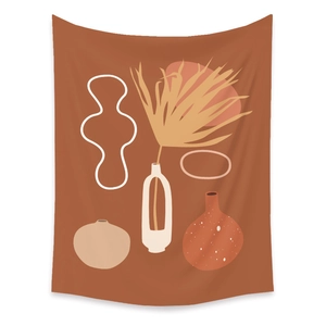 Detail view of Bohemian tapestry featuring abstract palm leaves and warm earth tones
