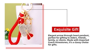 Macro detail of heart-shaped keychain with crystal rhinestones and red woven rope loop