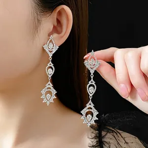 Elegant silver drop earrings with triple-layered diamond-set geometric crystal pendants