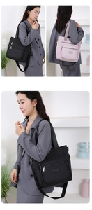 Fashionable Oxford cloth shoulder bags in black and pink with multiple zipper pockets