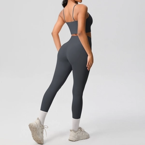 Detail view of high-waist yoga set in charcoal grey showing slim straps and seamless fit