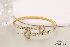 Detail of gold crystal heart bracelet showing dimensions 11.5mm and weight 8g on clean background