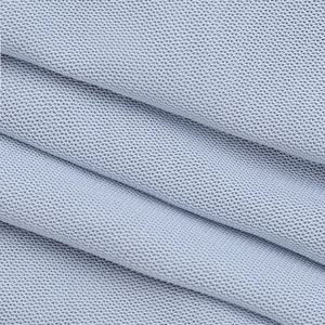 Vue macro de la texture du tissu et de la maille respirante du haut bustier sexy